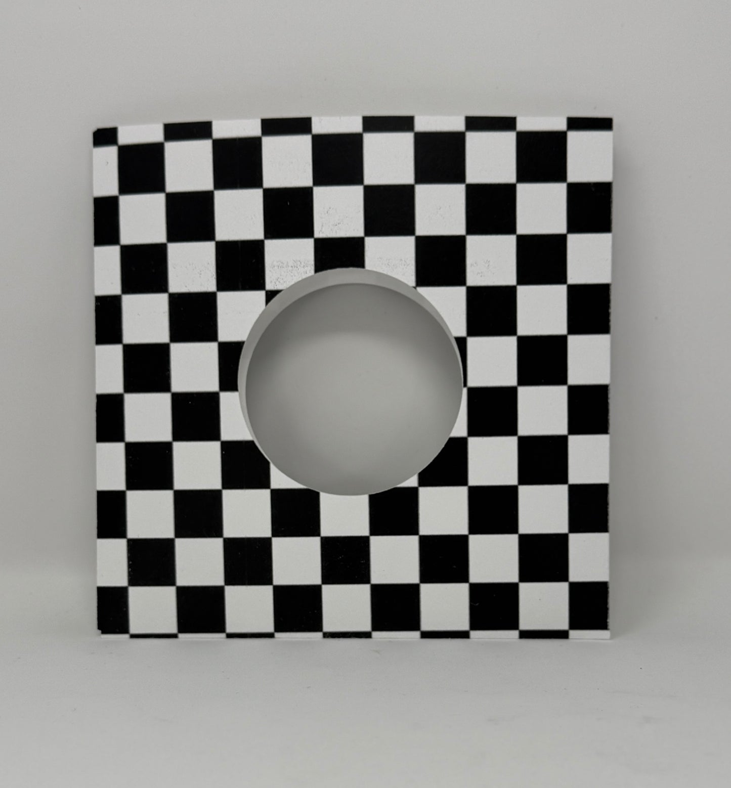 7" record sleeve cardsstock in black and white checkerboard pattern